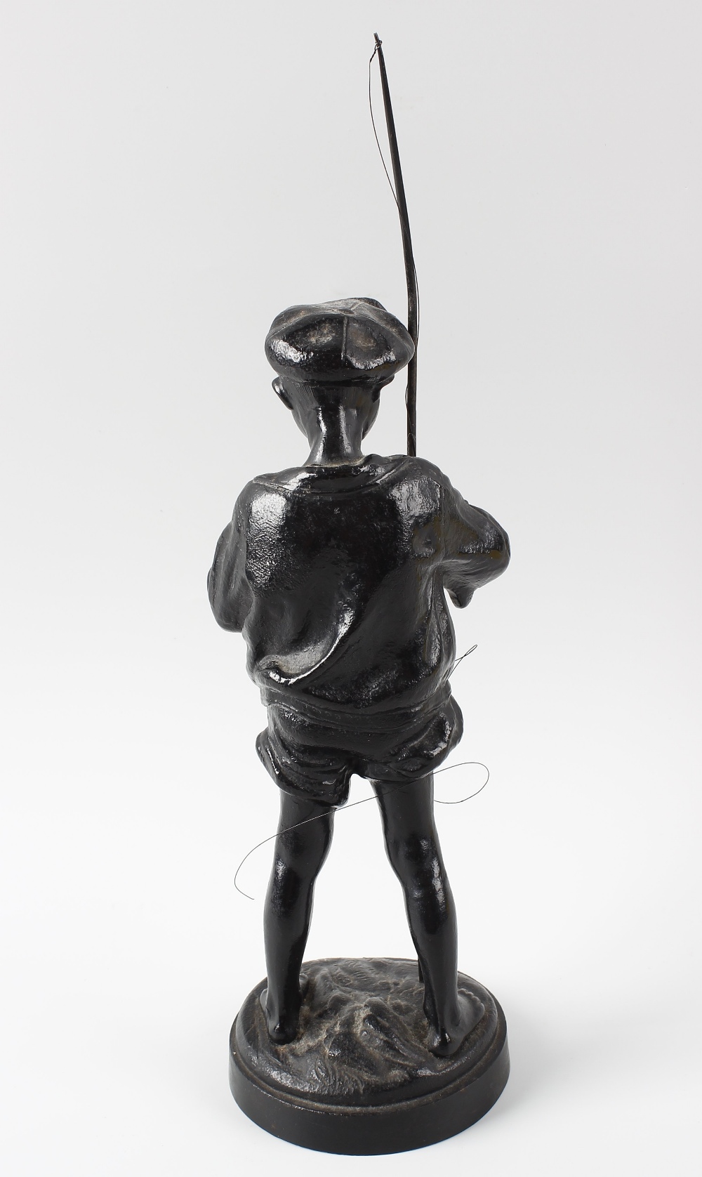A 20th century Russian iron figure. Modelled as a young fisherboy dressed in rolled up shorts and - Image 3 of 3