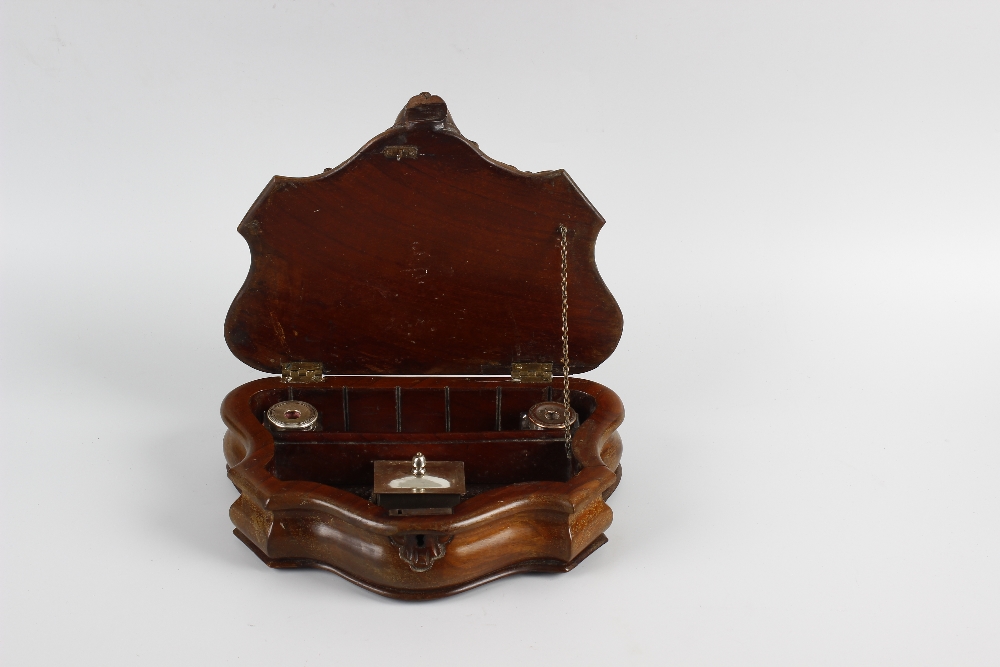 An unusual Victorian carved mahogany desk stand or writing box. Of serpentine form, the hinged cover - Image 2 of 2