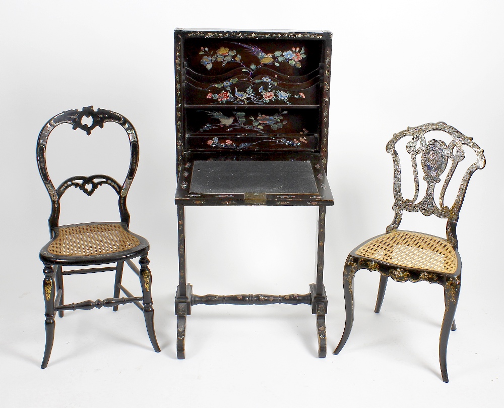 An unusual oriental black lacquered and mother-of-pearl inlaid folding desk, the hinged fall panel