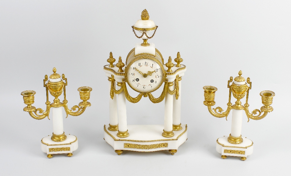 A French portico clock garniture. The white enamelled dial having Arabic numerals and floral swag