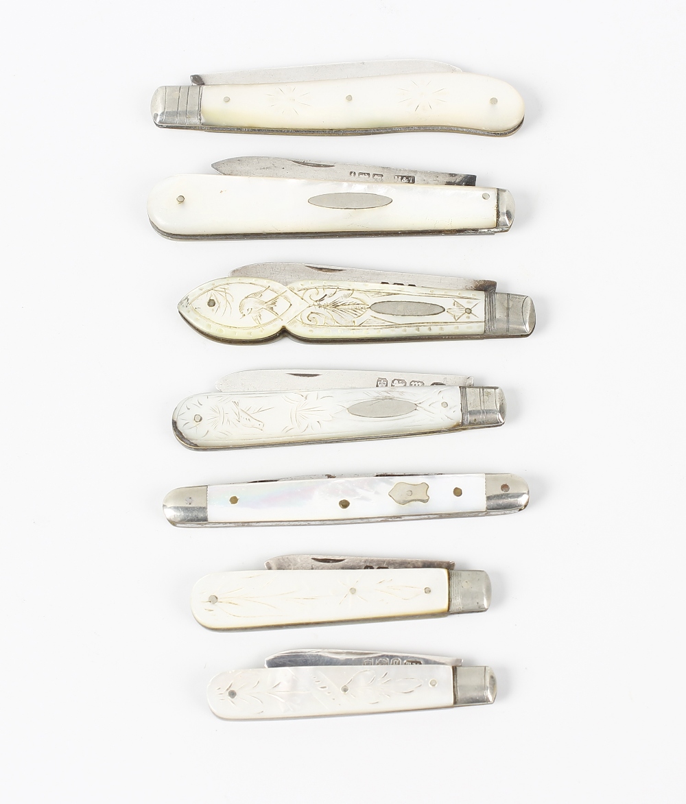 Six silver bladed fruit knives, each with a hallmarked folding blade and mother of pearl veneered
