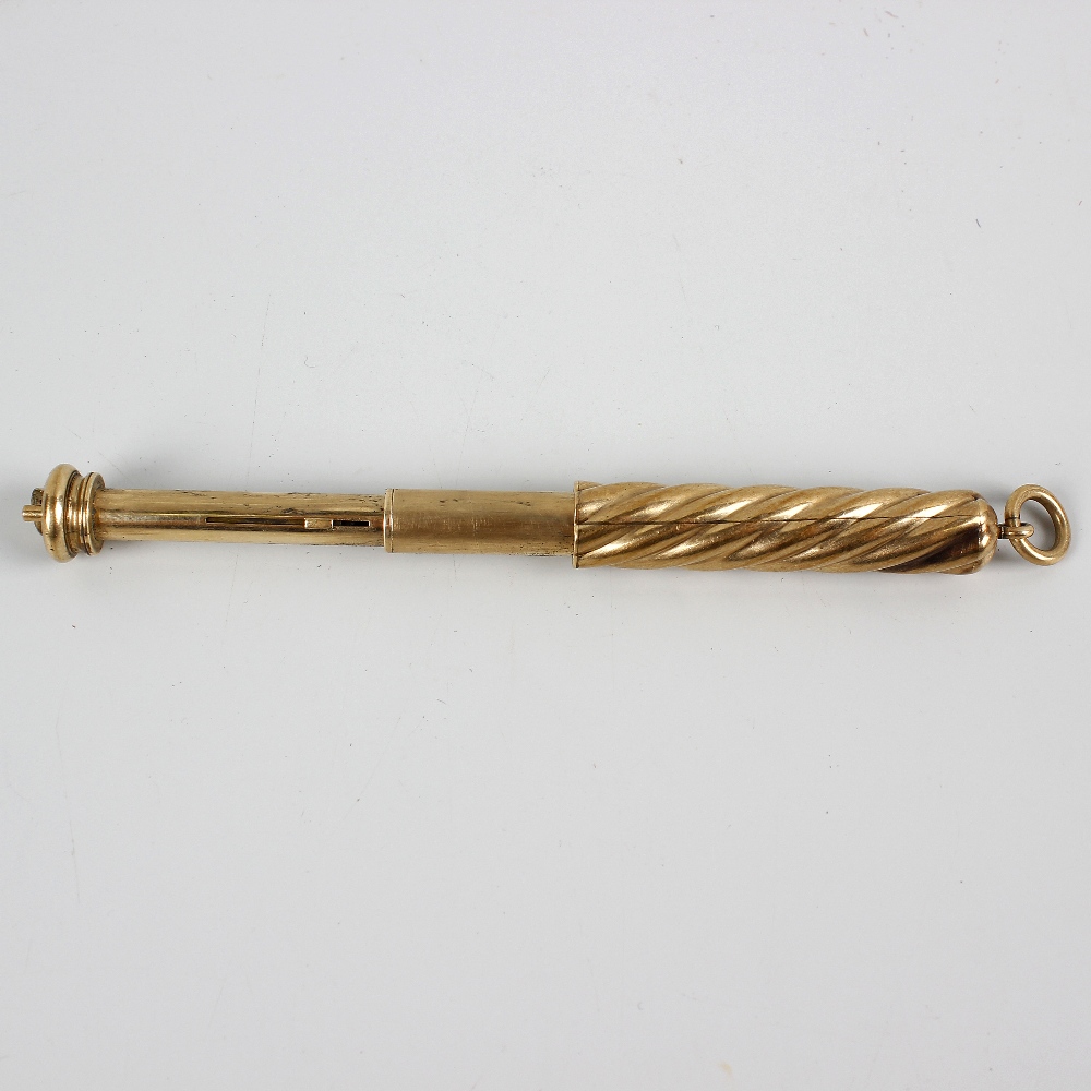 A Sampson Mordan & Co. yellow metal retractable combination pen and pencil. Of telescopic form