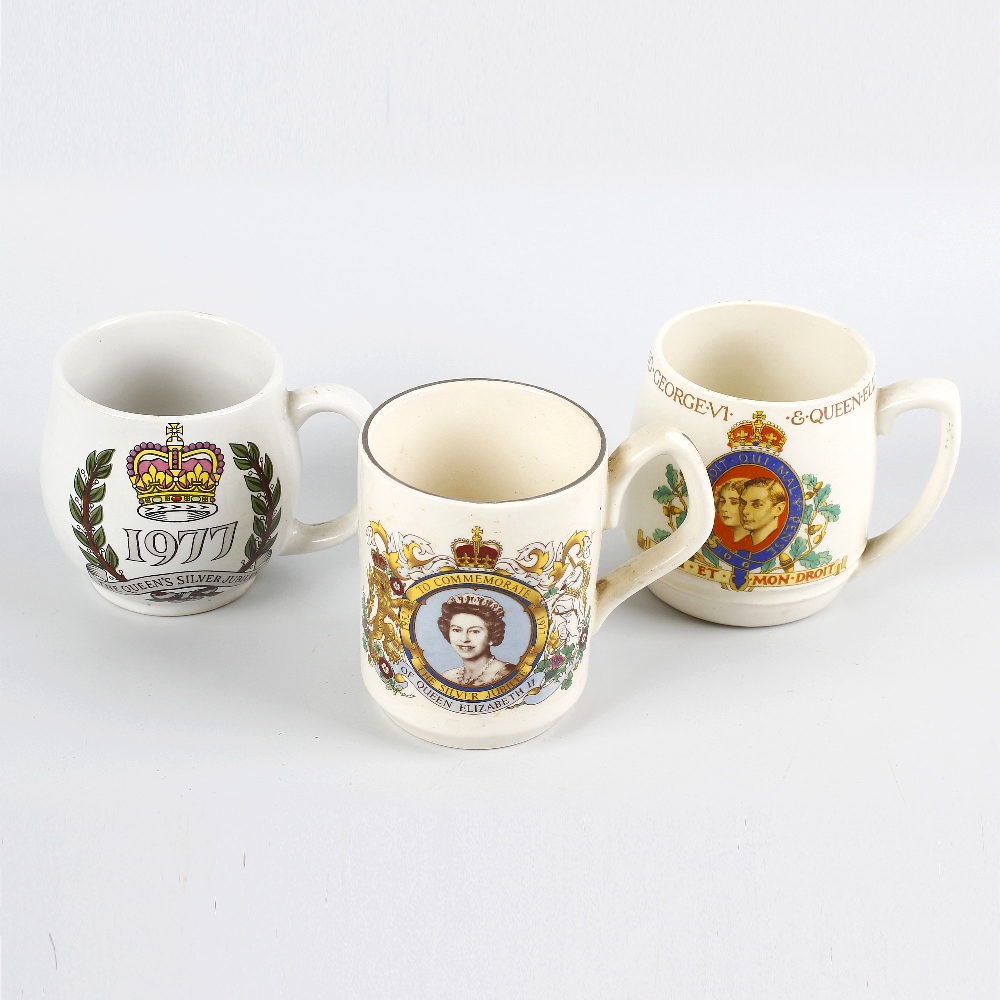 A box containing a mixed selection of commemorative pottery mugs, predominantly Queen Elizabeth