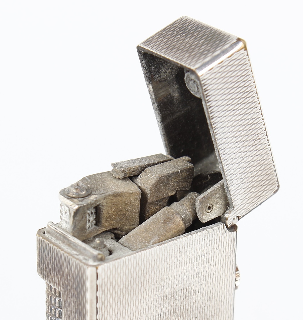 A Dunhill rollagas lighter, the rectangular shaped body with engine turned decoration, impressed - Image 3 of 4