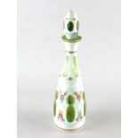 A Bohemian overlay glass bottle and stopper, of green glass having white overlay decorated with