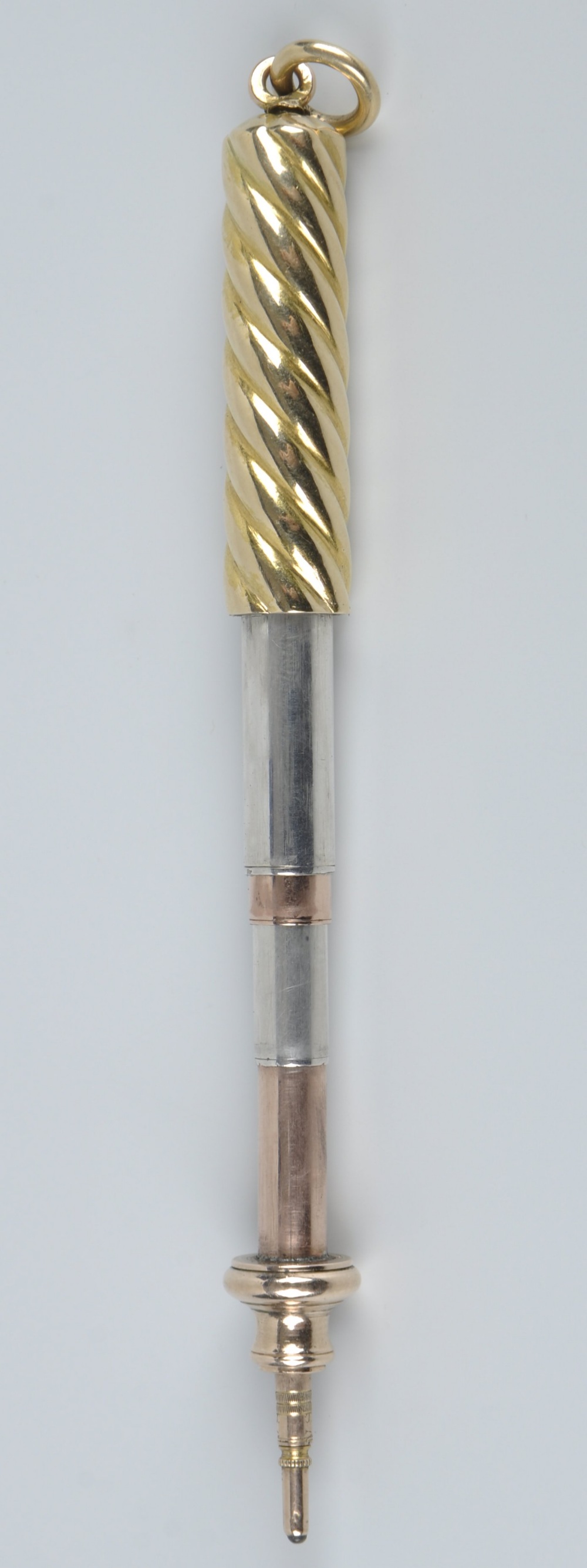 A yellow metal propelling pencil, unmarked, outer sleeve tests as 9ct, with spirally-reeded body - Image 2 of 2