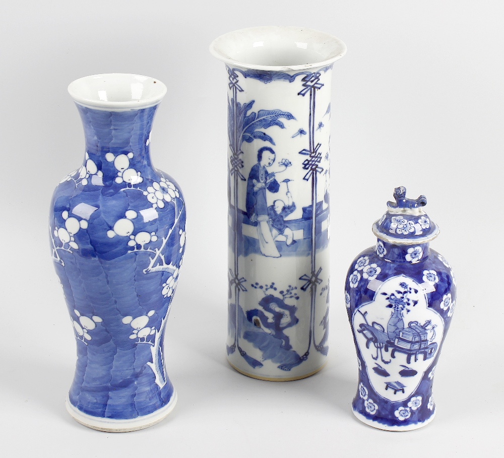 Three Chinese blue and white vases. Comprising one example of baluster form decorated with cherry