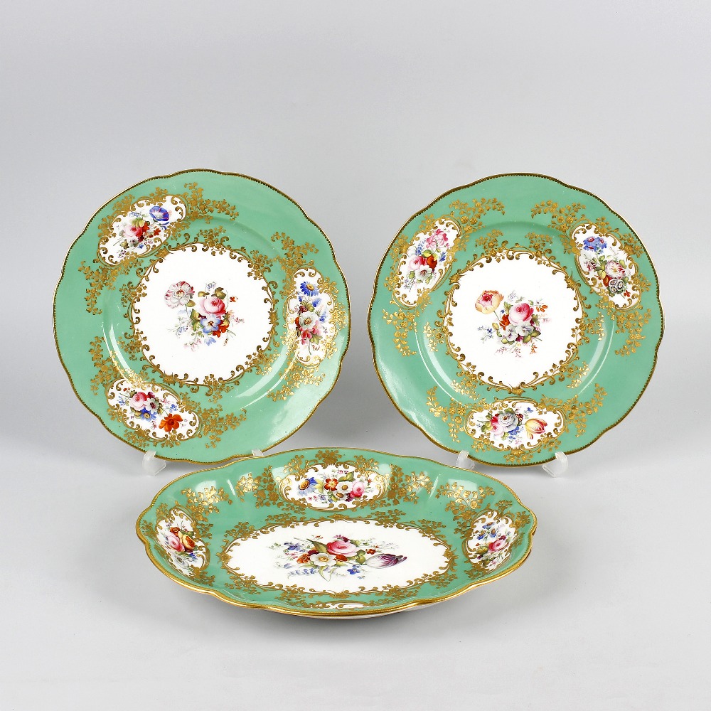 Four pieces of early 19th century Coalport-style porcelain. Comprising two serving plates of oval