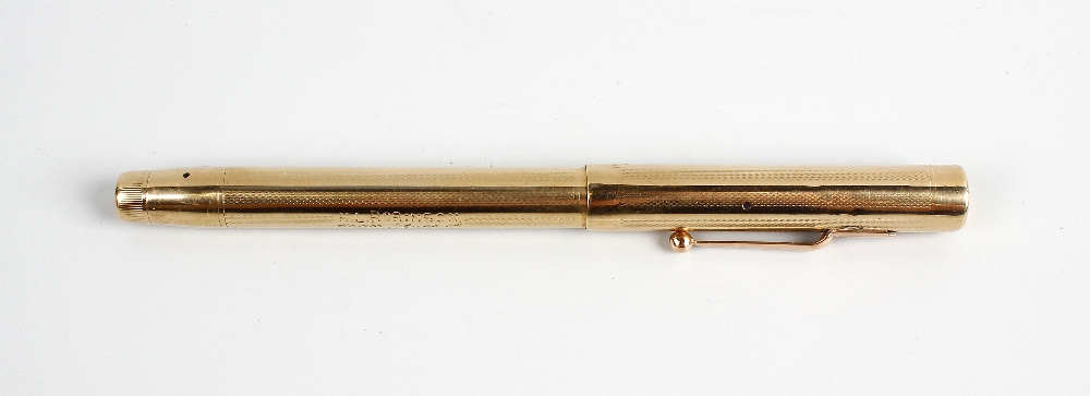 A 9ct gold 1937 Swan pen, having bands of engine turned decoration to body, and personal