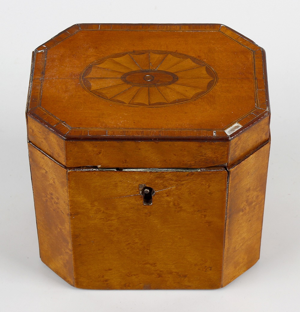 A George III inlaid satinwood tea caddy, of hinged canted oblong cover centred by a bat's wing