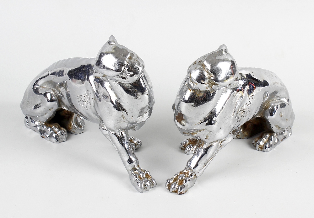 A pair of Art Deco style cast metal panthers, in seated position, 7 (17.75cm). (2). Slight