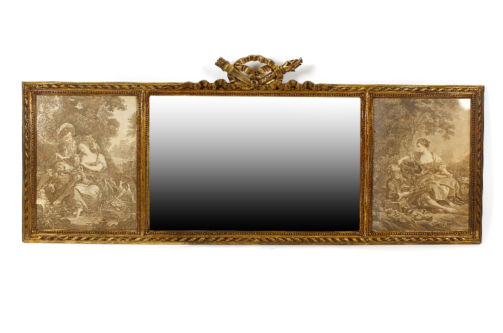 A gilt overmantel mirror. The rectangular mirror plate flanked by twin prints under glass