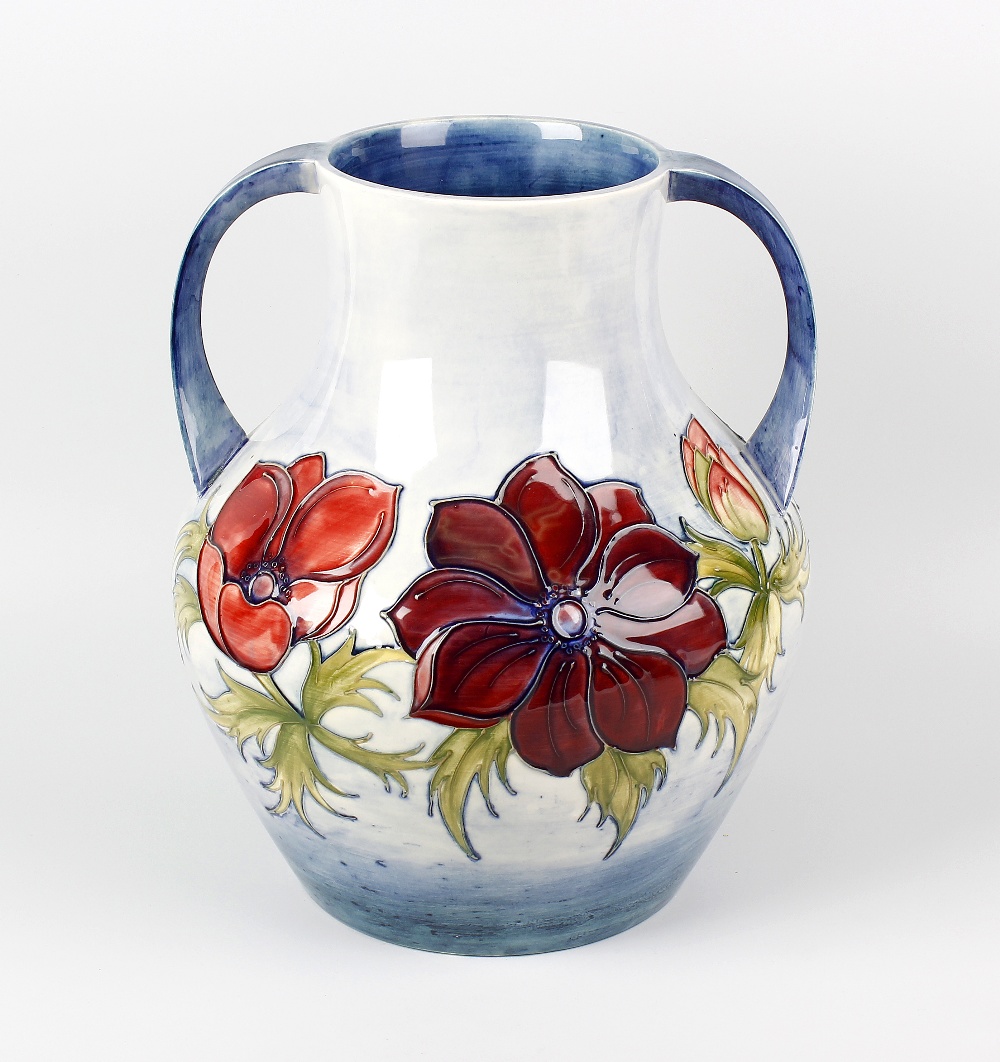 A large Moorcroft 'Anemone' pattern two-handled vase. Of bulbous form with tube-lined decoration