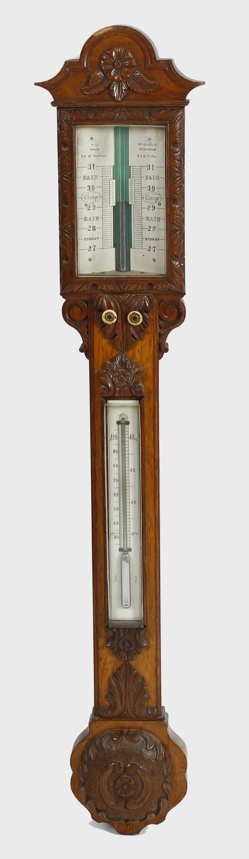 A late Victorian carved oak stick barometer Hill, Birmingham The break-arched and flowerhead-