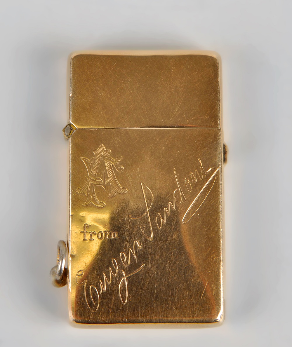 A 9ct gold lighter, of plain rectangular form having engraved monogram and dedication to front,