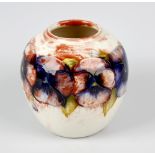 An unusual Walter Moorcroft 'Pansy' pattern vase Circa 1950, of ovoid form, with tube-lined