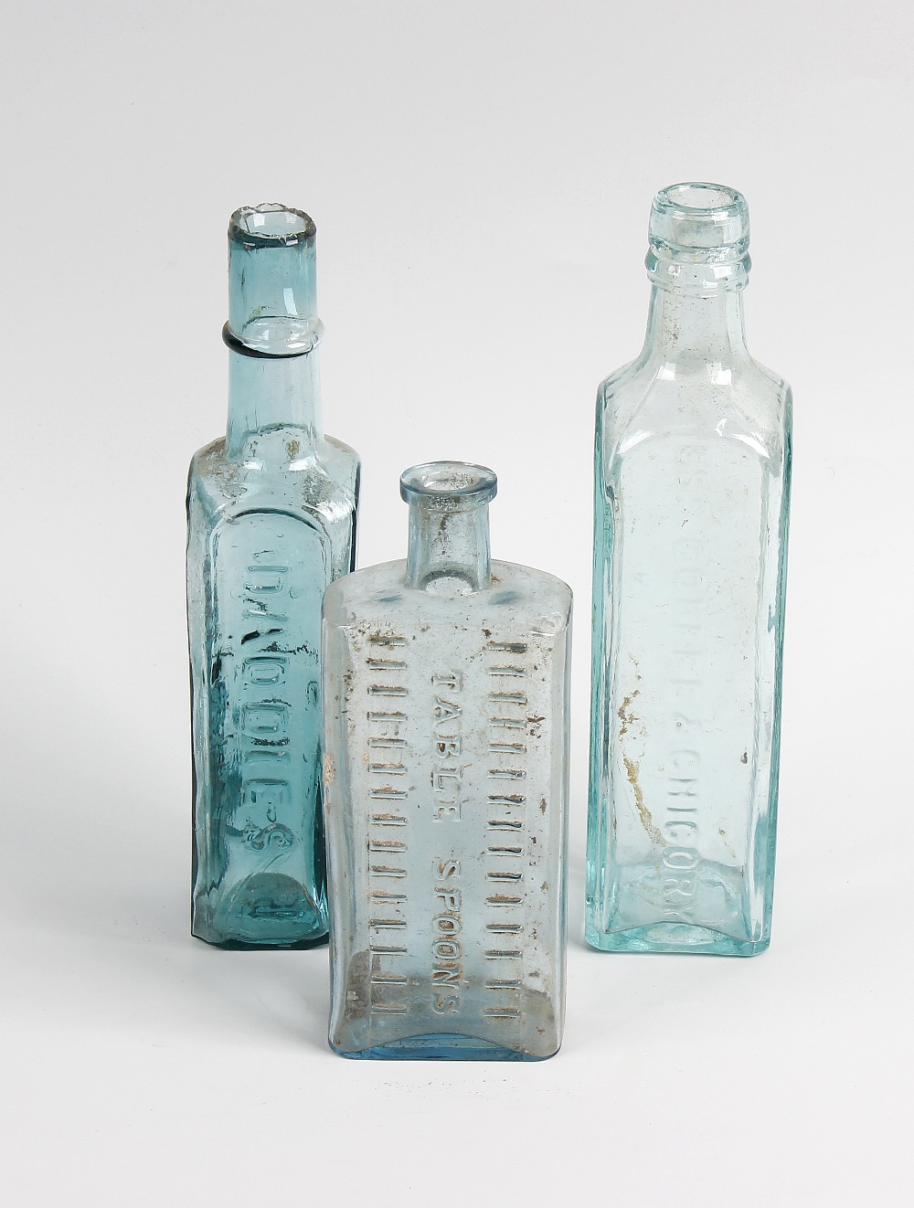 Two boxes containing a large collection of assorted glass bottles Principally antique condiment