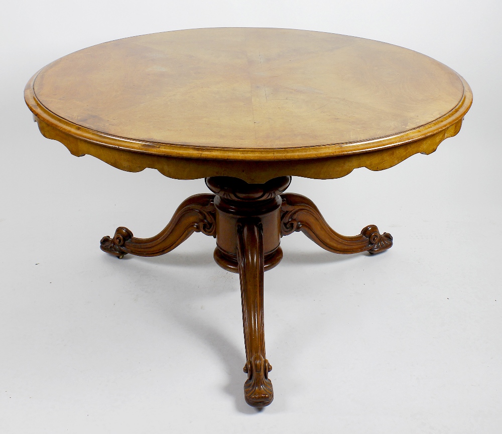 A 19th century walnut and mahogany breakfast or centre table. The walnut veneered top with moulded