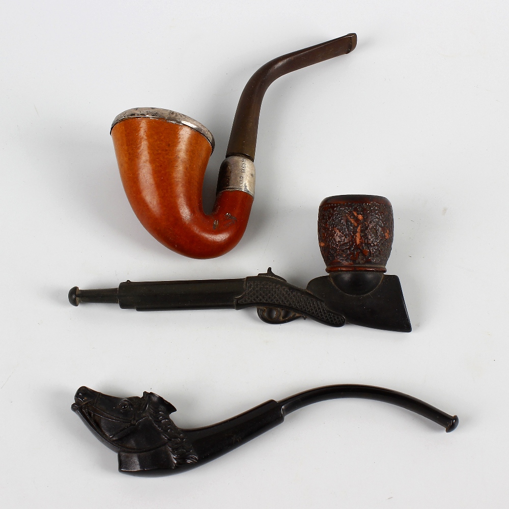 Three assorted pipes. Comprising two novelty examples carved as a rifle and a horse's head