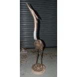 A 20th Century lead figure of a heron wi