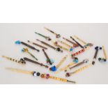 A collection of fourteen bone bobbins fo