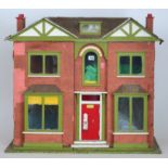 A 1920s painted wooden dolls house, doub