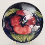 A William Moorcroft circular lid decorat