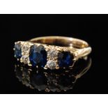 An 18ct sapphire and diamond cluster rin