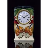 A Moorcroft Pottery mantel clock decorat