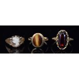 Three assorted 9ct stone set rings, a ti