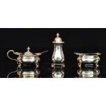 A hallmarked silver three piece cruet se