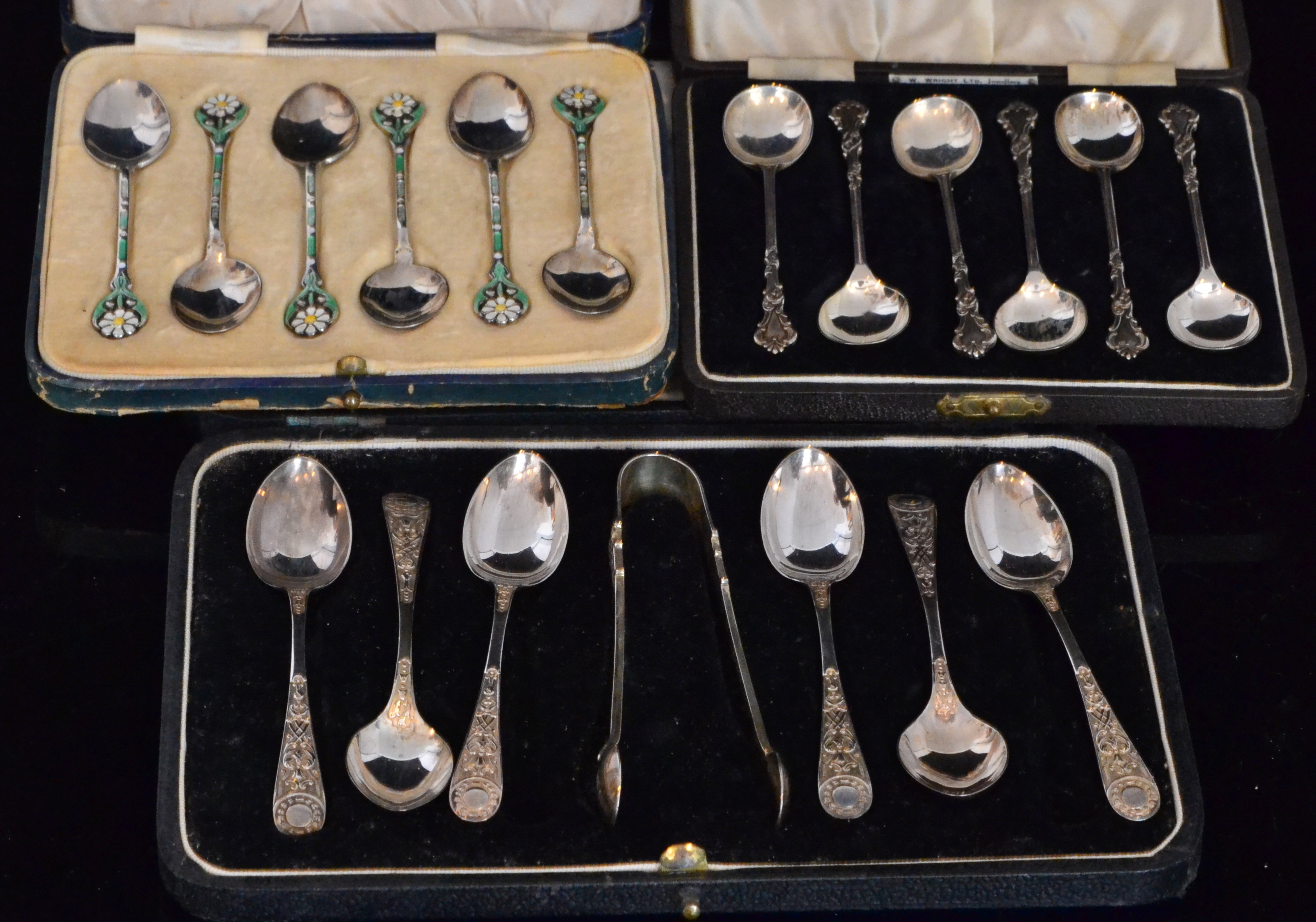 Three cased sets of teaspoons to include