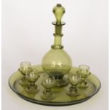 An early 20th decanter tray set in the m