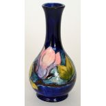 A Moorcroft Magnolia pattern bottle vase