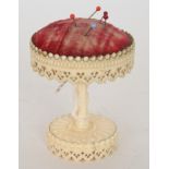 A 19th Century ivory pin cushion of circ