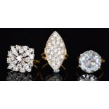 Three silver gilt cubic zirconia rings a