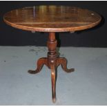 A Georgian oak snap-top supper table of