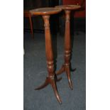 A pair of mahogany torcheres, with circu