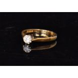 An 18ct solitaire diamond ring, the bril