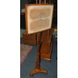 A 19th Century mahogany pole screen, wit