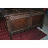 An 18th Century oak coffer the carved do