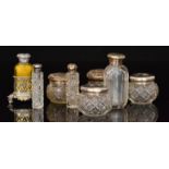 Four cut glass and silver mounted jars,
