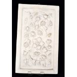 A relief moulded plaster panel with a sp