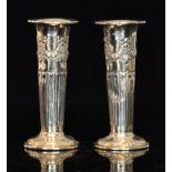 A pair of hallmarked silver trumpet vase