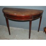 A Georgian mahogany demi-lune table with