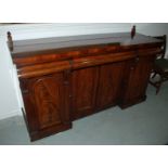 A Victorian mahogany inverted breakfront