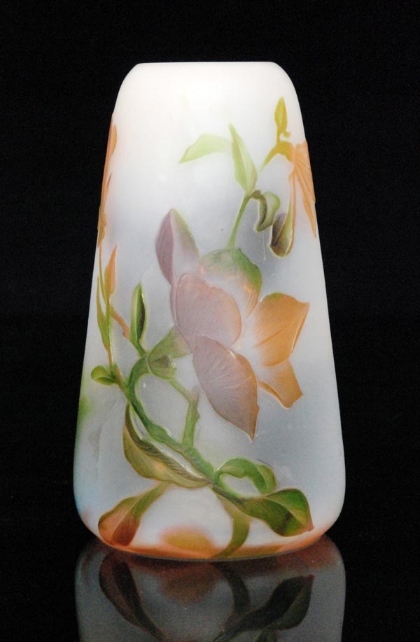 Harrach - An early 20th Century cameo glass vase of tapered sleeve form, cased in tonal pink, green