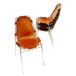 Charlotte Perriand - Four 'Les Arcs' brown leather and chromium plated stacking chairs,