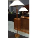 Merchant Adventurers - A teak and metal mounted standard lamp with white conical metal shade,