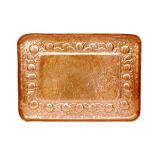 Newlyn - A large early 20th Century Arts and Crafts rectangular copper tray decorated with a